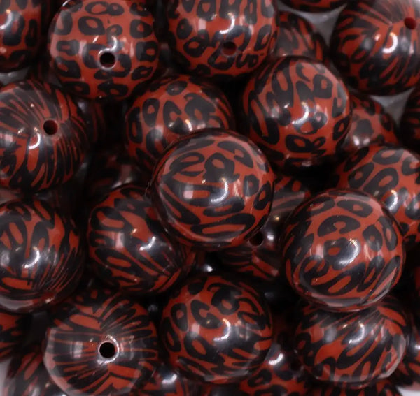 close up view of a pile of 20mm Brown & Black Leopard Animal Print Bubblegum Beads