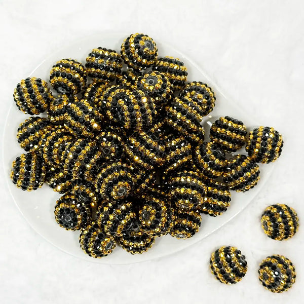 top view of a pile of 20mm Black and Gold Striped Rhinestone Bubblegum Beads