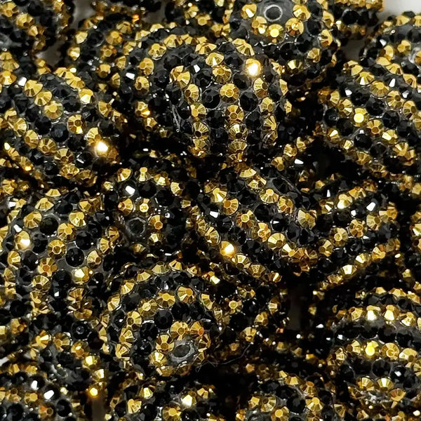 close up view of a pile of 20mm Black and Gold Striped Rhinestone Bubblegum Beads