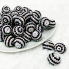 front view of a pile of 20mm Black and White Striped Rhinestone Bubblegum Beads