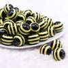 front view of a pile of 20mm Yellow & Black Striped Chunky Bubblegum Beads