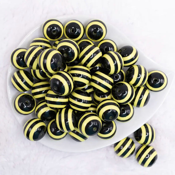 top view of a pile of 20mm Yellow & Black Striped Chunky Bubblegum Beads