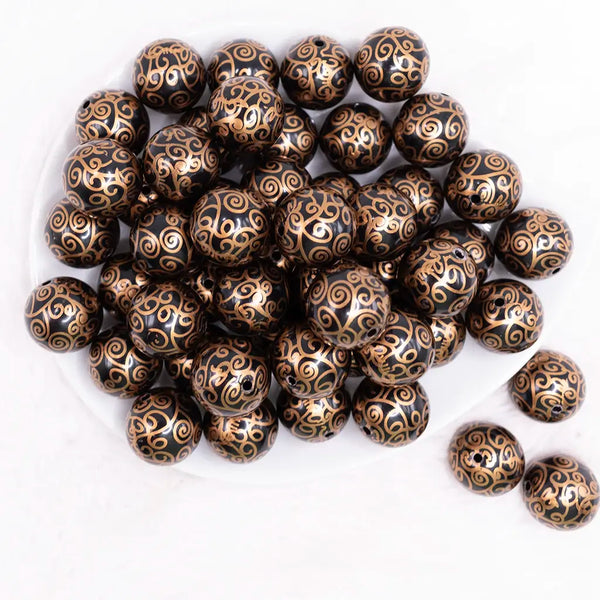 top view of a pile of 20mm Black with Gold Filigree Printed Acrylic Bubblegum Beads