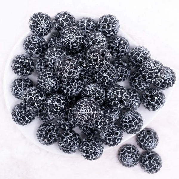 top view of a pile of 20mm Black & White Spider Web Rhinestone Bubblegum Beads