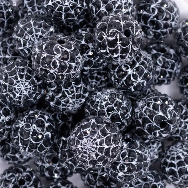 close up view of a pile of 20mm Black & White Spider Web Rhinestone Bubblegum Beads