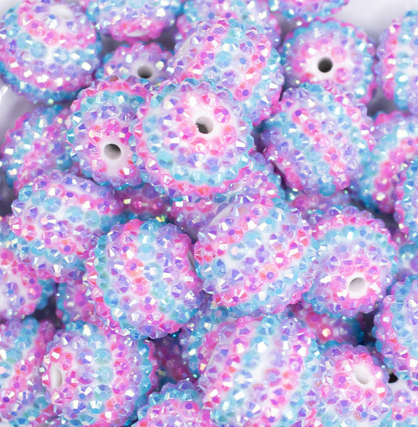 close up view of a pile of 20mm Blue And Purple Striped AB Rhinestone Bubblegum Beads