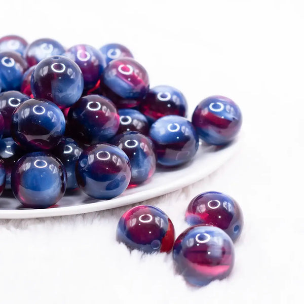 front view of a pile of 20mm Blue and Red Illusion Glitter Bubblegum Bead