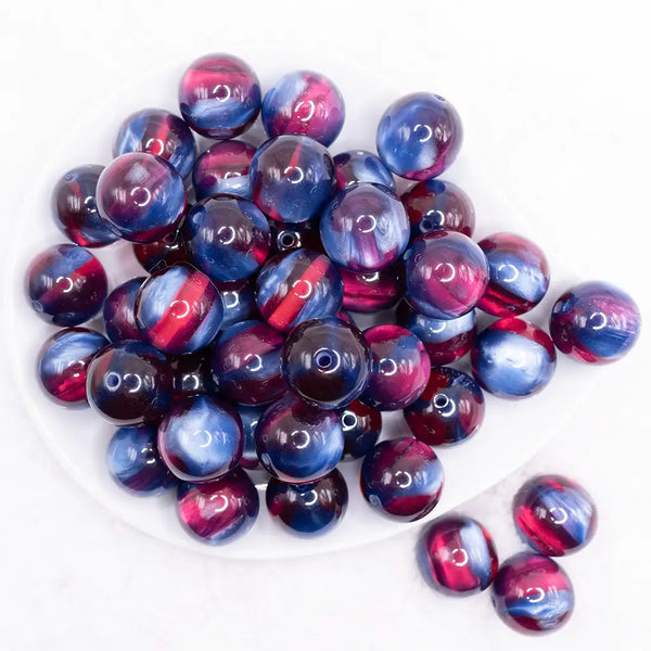 top view of a pile of 20mm Blue and Red Illusion Glitter Bubblegum Bead