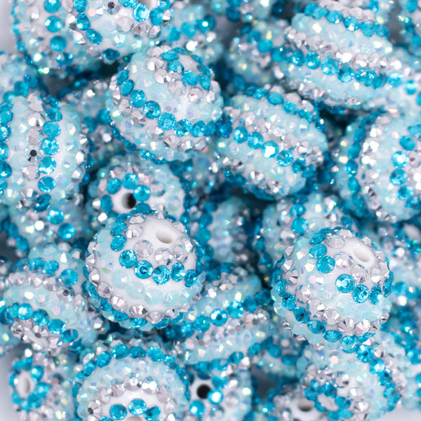 close up view of a pile of 20mm Blue and Silver Striped AB Rhinestone Bubblegum Beads
