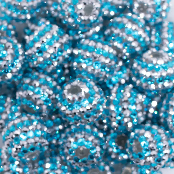 close up view of a  pile of 20mm Blue and Silver Striped AB Rhinestone Bubblegum Beads