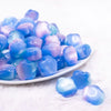 front view of a pile of 20mm Blue Opal Flower Shaped Acrylic Beads