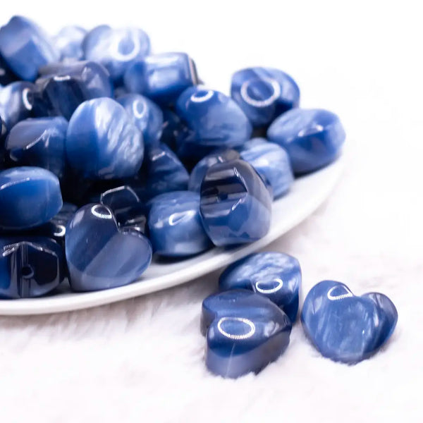 front view of a pile of 20mm Blue Opal Heart Shaped Acrylic Beads