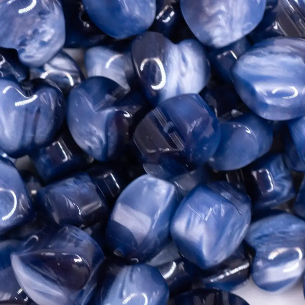 close up view of a pile of 20mm Blue Opal Heart Shaped Acrylic Beads