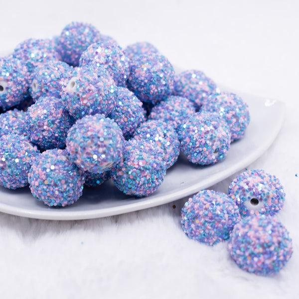 front view of a pile of 20mm Purple and Blue Sequin Confetti Bubblegum Beads