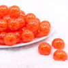 front view of a pile of 20mm Bright Orange Crackle Bubblegum Beads
