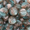 close up view of a pile of 20mm Greenish Brown Illusion Glitter Bubblegum Bead