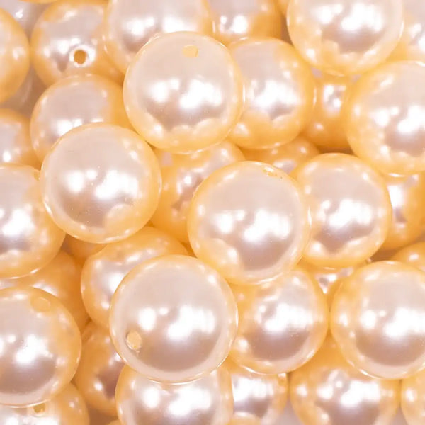 close up view of a pile of 20mm Cream Faux Pearl Bubblegum Beads