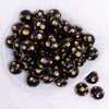 top view of a pile of 20mm Gold Polka Dots on Black Acrylic Bubblegum Beads