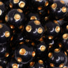 close up view of a pile of 20mm Gold Polka Dots on Black Acrylic Bubblegum Beads
