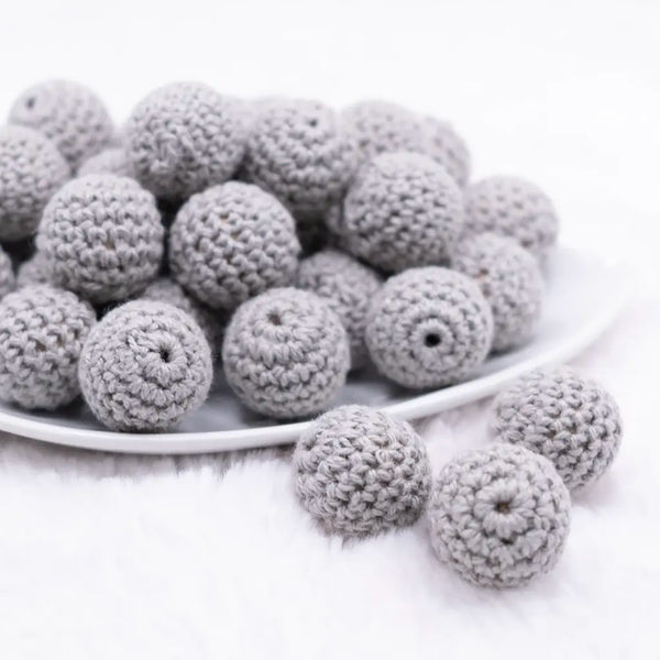 front view of a pile of 20mm Gray Crochet wooden bead