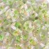 close up view of a pile of 20mm Lime Green Flaked Flower Bubblegum Bead