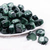 front view of a pile of 20mm Green Opal Heart Shaped Acrylic Beads