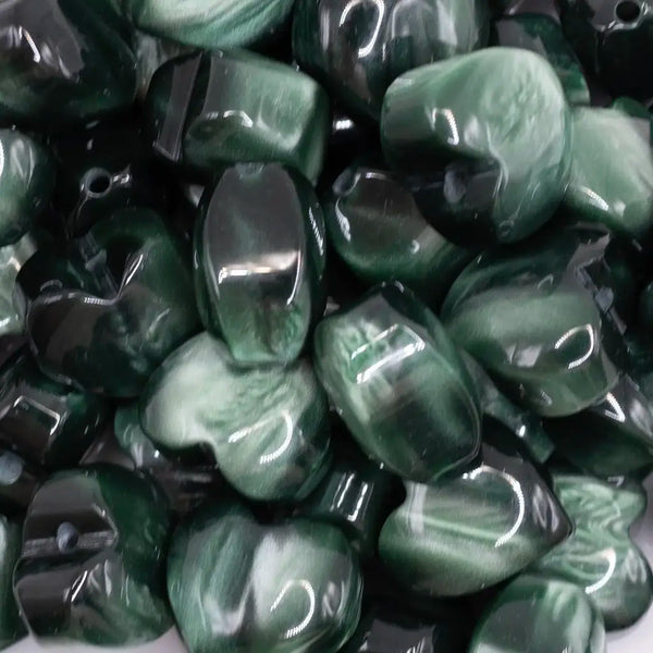 close up view of a pile of 20mm Green Opal Heart Shaped Acrylic Beads