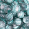 close up view of a pile of 20mm Green Illusion Glitter Bubblegum Bead