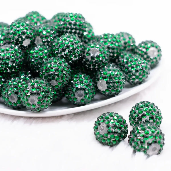 front view of a pile of 20mm Green Rhinestone on clear Bubblegum Beads - imperfect