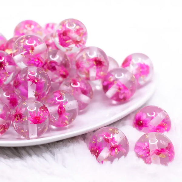 front view of a pile of 20mm Hot Pink Flaked Flower Bubblegum Bead