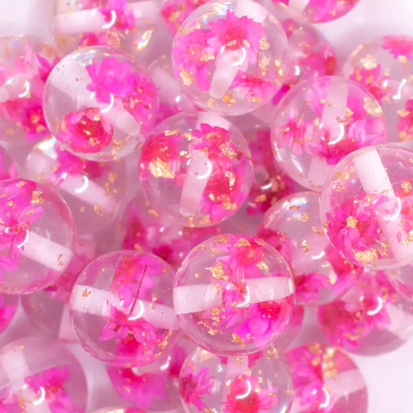 close up view of a pile of 20mm Hot Pink Flaked Flower Bubblegum Bead