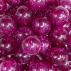 close up view of a pile of 20mm Hot Pink Glitter Tinsel Bubblegum Beads