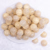 top view of a pile of 20mm Ivory Luster Bubblegum Beads