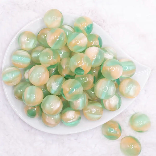 top view of a pile of 20mm Light Green Illusion Glitter Bubblegum Bead