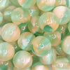 close up view of a pile of 20mm Light Green Illusion Glitter Bubblegum Bead