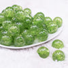 front view of a pile of 20mm Lime Green Glitter Tinsel Bubblegum Beads
