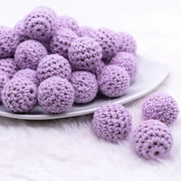 front view of a pile of 20mm Lilac Purple Crochet wooden bead