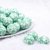front view of a pile of 20mm Mint Green Cow Print Bubblegum Beads