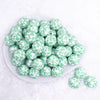 top view of a pile of 20mm Mint Green Cow Print Bubblegum Beads