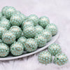 front view of a pile of 20mm Mint Quarterfoil Print Bubblegum Beads