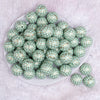 top view of a pile of 20mm Mint Quarterfoil Print Bubblegum Beads
