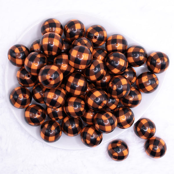 top view of a pile of 20mm Orange and Black Plaid Bubblegum Beads