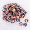 top view of a pile of 20mm Orange and Black Striped Rhinestone Bubblegum Beads