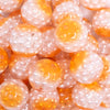 close up view of a pile of 20mm Orange Captured Pearls Bubblegum Bead