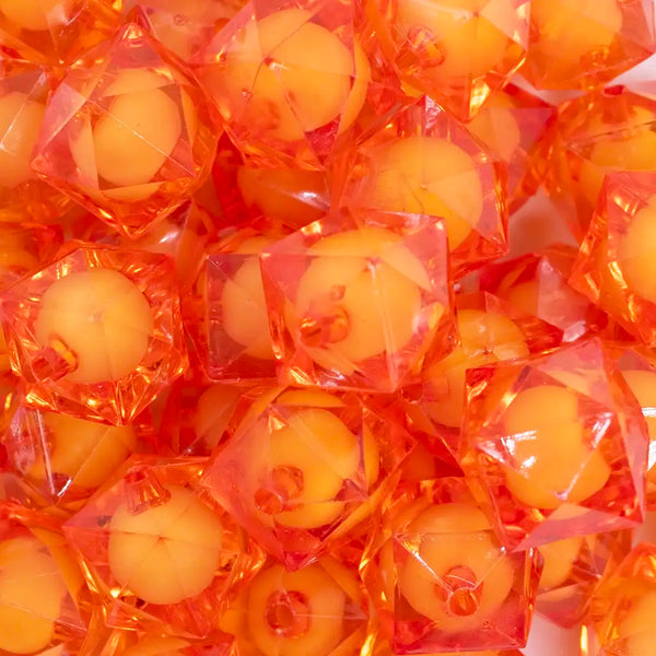 close up view of a pile of 20mm Orange Transparent Cube with Middle Bubblegum Beads