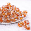 front view of a pile of 20mm Orange Flaked Flower Bubblegum Bead