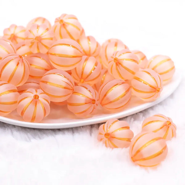 front view of a pile of 20mm Orange Frosted Pumpkin Shaped Bubblegum Bead