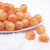 front view of a pile of 20mm Orange Luster Bubblegum Beads