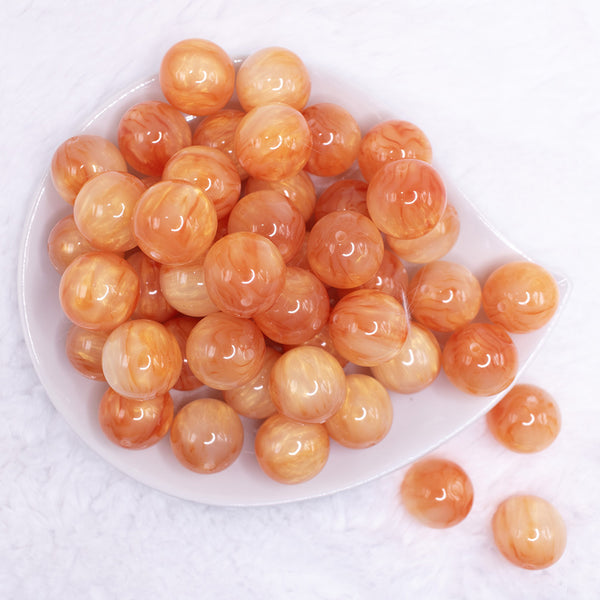 top view of a pile of 20mm Orange Luster Bubblegum Beads