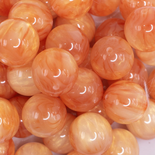 close up view of a pile of 20mm Orange Luster Bubblegum Beads